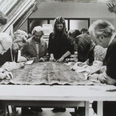 King's bed group b+w Volunteers conserving the Cloth of Gold King's Bed textiles, led by conservator Philippa Lawrence (centre)