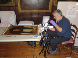 Ian Tyers conducting dendrochronology tests on some early 17th century portraits in Knole's Brown Gallery