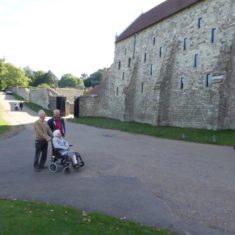 Kay and her sons, Ian and Paul admiring the conserved exterior of the medieval Barn at Knole in 2018