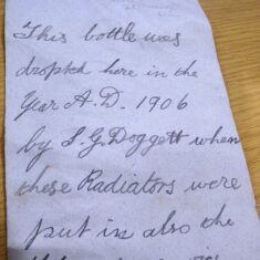 1906 message Handwritten and left in a bottle by Sidney Doggett in 1906 while he was installing radiators in the Knole Attics
