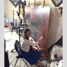 Paintings conservator working in temporary workspace