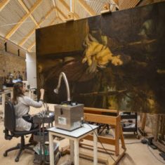 Sarah working on a Reynolds portrait in the Royal Oak Foundation conservation studio at Knole, Kent | NT Images